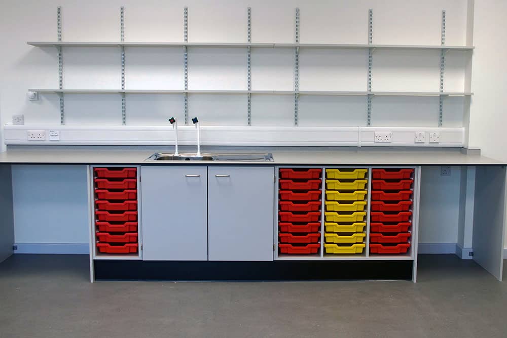 Bury College science laboratory prep room tray storage and sink.