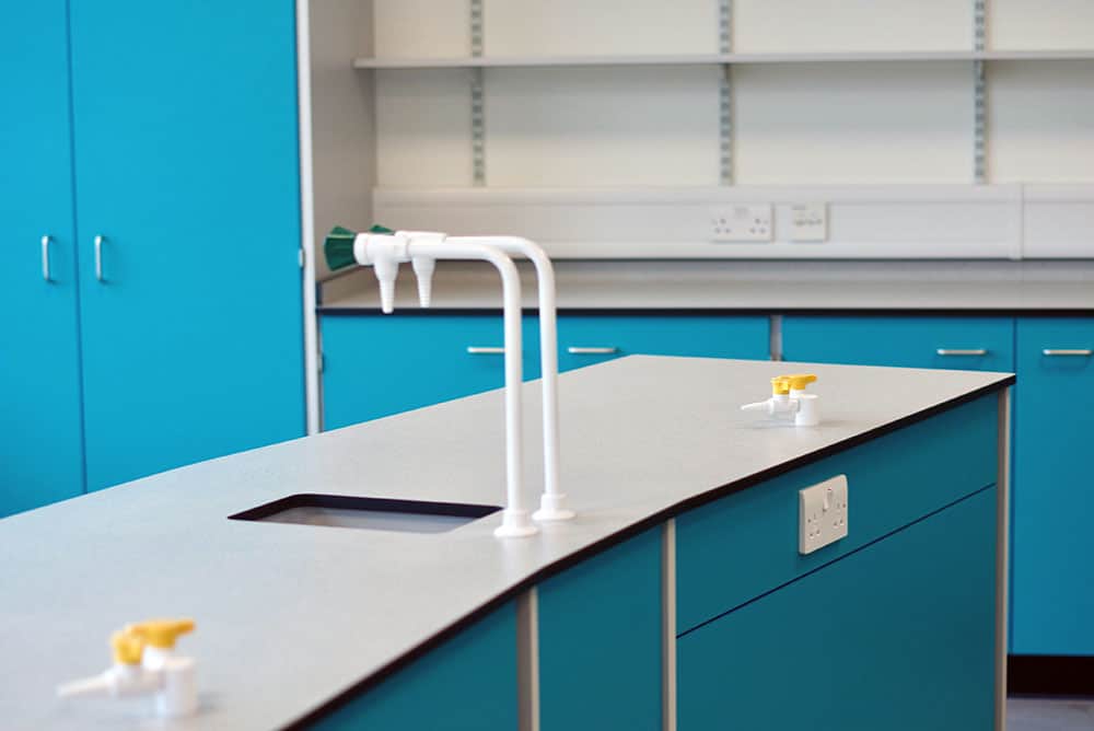 Bury College science lab benching with sink and gas tap.