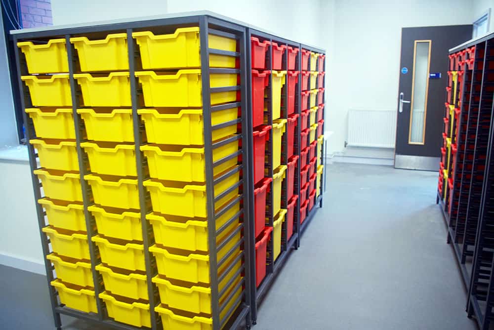 Bury College science lab prep room with large tray storage.