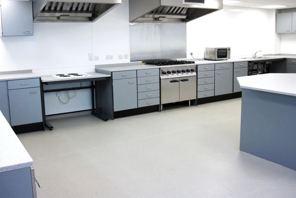 Heaton School food technology classroom with benching and fixed island bench.