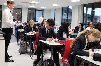 Students in science classroom. Loose table layout suitable for theory lessons.